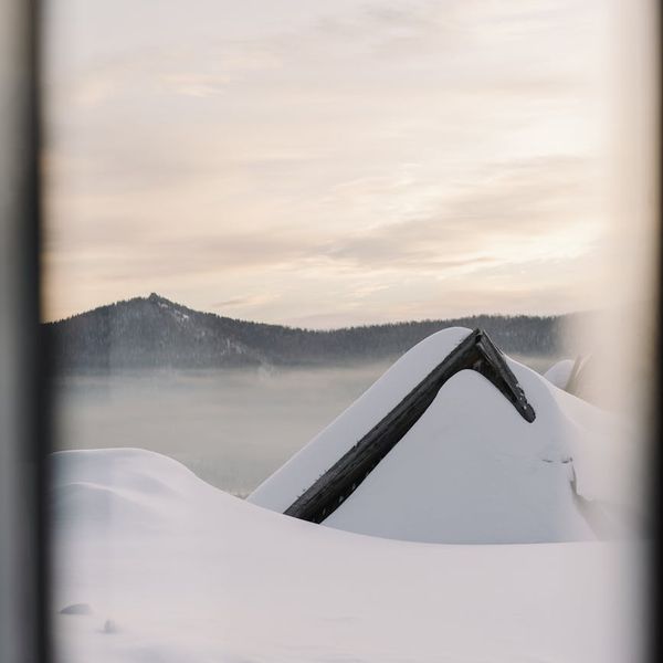 A calm and serene landscape with a meditating silhouette.